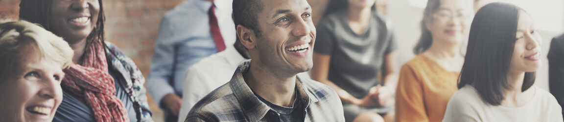 people in the audience laughing