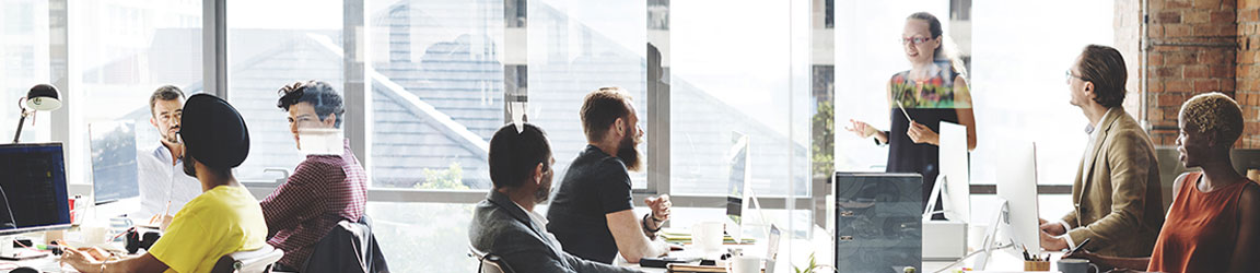 Woman leading a meeting in a casual office space.